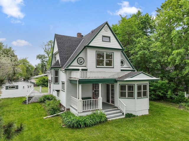 216 Summit Ave, Center City, MN 55012 - victorian home with a shingled roof, a porch, and a front yard