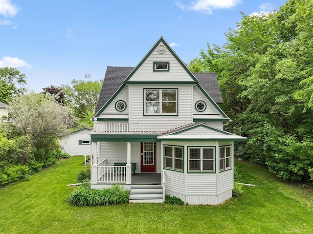216 Summit Ave, Center City, MN 55012 - rear view of property featuring covered porch, a lawn, and roof with shingles