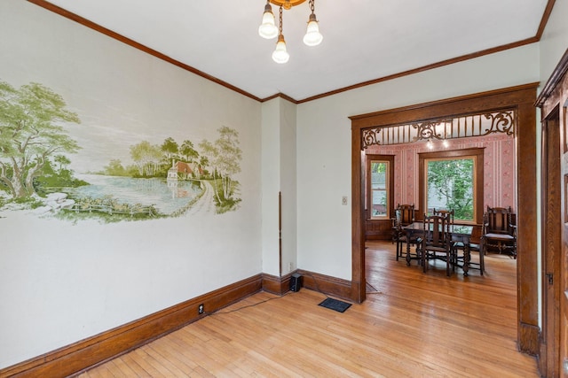216 Summit Ave, Center City, MN 55012 - spare room with light wood-style floors, baseboards, a chandelier, and crown molding