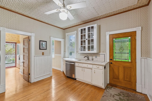 216 Summit Ave, Center City, MN 55012 - kitchen featuring dishwasher, ornamental molding, light wood-style flooring, wallpapered walls, and plenty of natural light