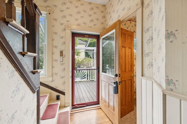 216 Summit Ave, Center City, MN 55012 - foyer featuring wallpapered walls, light wood-style floors, and stairway