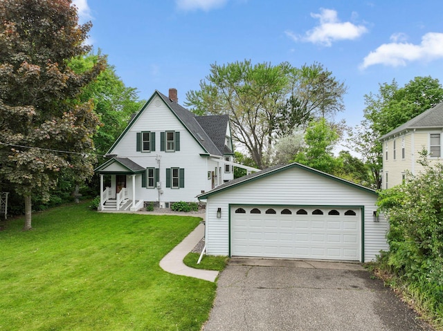 216 Summit Ave, Center City, MN 55012 - view of front facade with a chimney, a detached garage, a front yard, and an outdoor structure