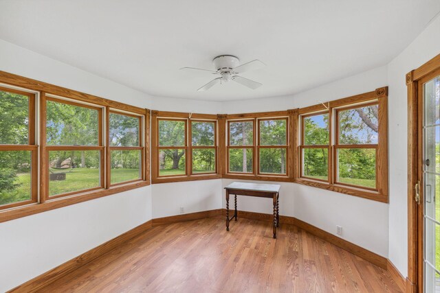 216 Summit Ave, Center City, MN 55012 - unfurnished sunroom featuring wood finished floors and baseboards