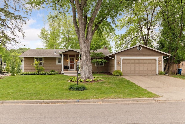 1709 Baywood Ln, Mound, MN 55364 - single story home with concrete driveway, an attached garage, a chimney, and a front yard