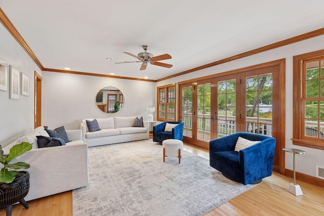 1709 Baywood Ln, Mound, MN 55364 - living room featuring wood finished floors, french doors, a ceiling fan, ornamental molding, and baseboards