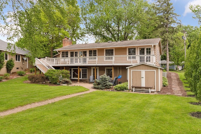 1709 Baywood Ln, Mound, MN 55364 - rear view of house featuring a deck, a chimney, a yard, and stairway