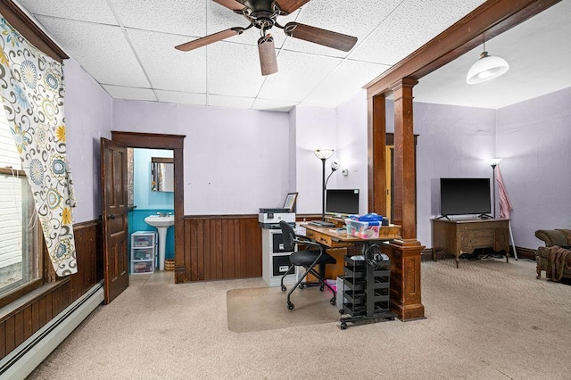 2718 3rd St, Duluth, MN 55806 - carpeted home office featuring baseboard heating, a drop ceiling, a wainscoted wall, ceiling fan, and ornate columns