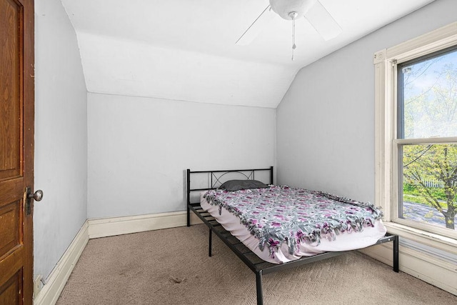 2718 3rd St, Duluth, MN 55806 - carpeted bedroom featuring lofted ceiling, multiple windows, a ceiling fan, and baseboards