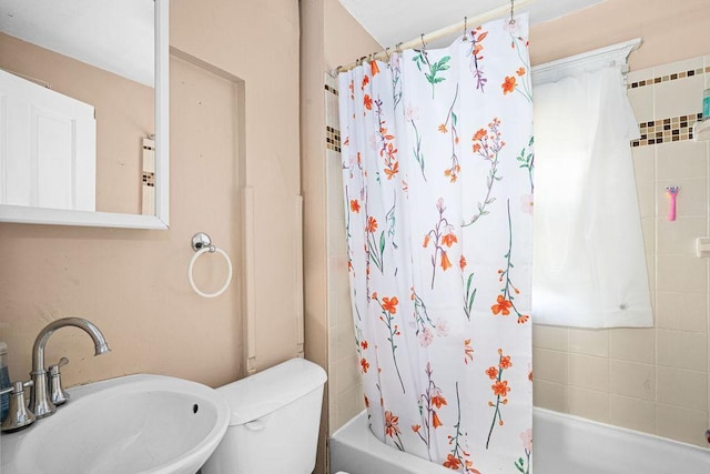 2718 3rd St, Duluth, MN 55806 - bathroom featuring a sink, shower / tub combo with curtain, and toilet