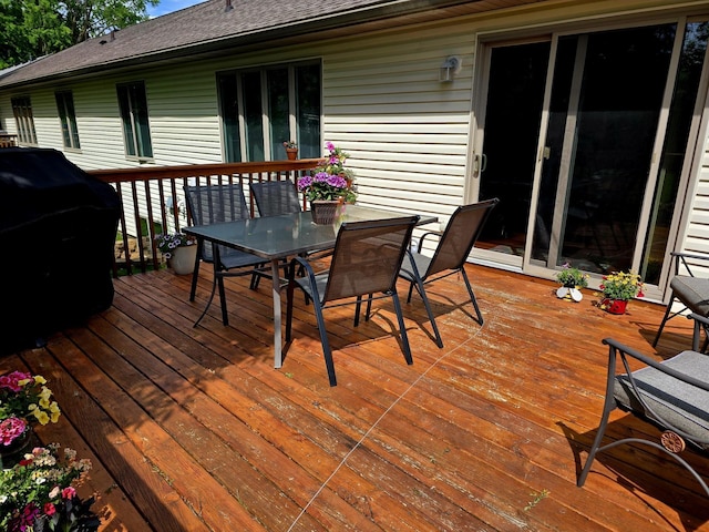 1612 17th St SW, Austin, MN 55912 - wooden deck with outdoor dining area