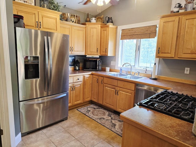 1612 17th St SW, Austin, MN 55912 - kitchen with stainless steel fridge, a sink, black microwave, a ceiling fan, and stovetop