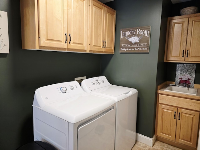 1612 17th St SW, Austin, MN 55912 - laundry area featuring cabinet space, washer and clothes dryer, baseboards, and light tile patterned flooring