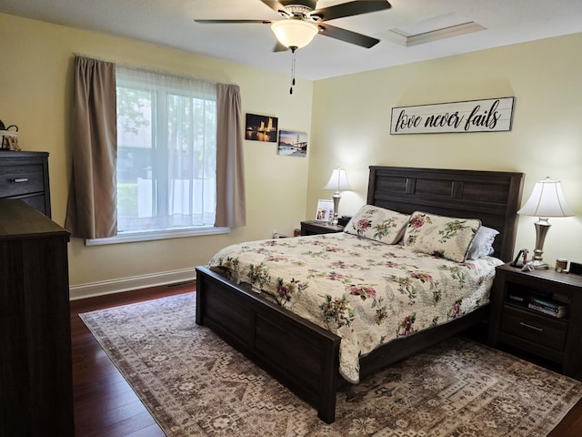 1612 17th St SW, Austin, MN 55912 - bedroom with dark wood-type flooring, baseboards, and ceiling fan