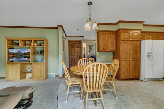 2904 Park Dr, Saint Cloud, MN 56303 - dining space featuring a chandelier and ornamental molding