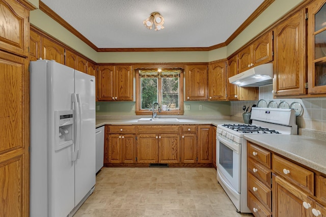 2904 Park Dr, Saint Cloud, MN 56303 - kitchen with white appliances, under cabinet range hood, brown cabinets, a textured ceiling, and ornamental molding