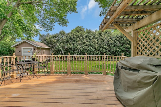 2904 Park Dr, Saint Cloud, MN 56303 - wooden terrace featuring grilling area, a lawn, outdoor dining area, and view of scattered trees