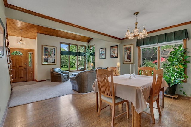 2904 Park Dr, Saint Cloud, MN 56303 - dining room with a chandelier, wood finished floors, lofted ceiling, and ornamental molding