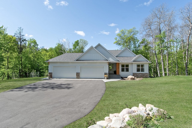 31709 Green Scene Dr, Breezy Point, MN 56472 - view of front facade with a garage, driveway, a front yard, and a shingled roof