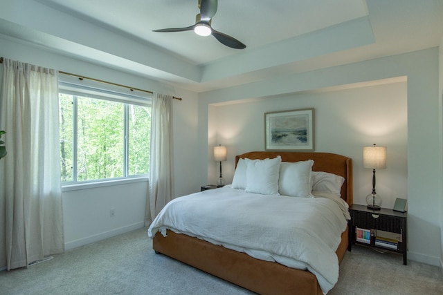 31709 Green Scene Dr, Breezy Point, MN 56472 - bedroom featuring carpet floors, baseboards, a raised ceiling, and ceiling fan