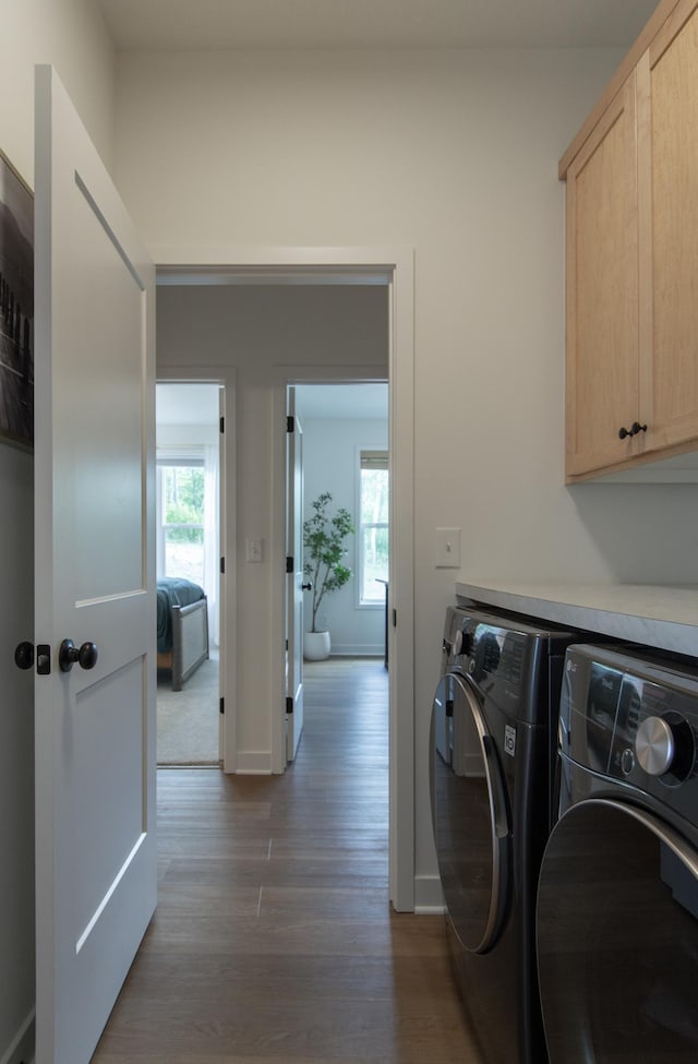 31709 Green Scene Dr, Breezy Point, MN 56472 - washroom featuring cabinet space, separate washer and dryer, wood finished floors, and plenty of natural light