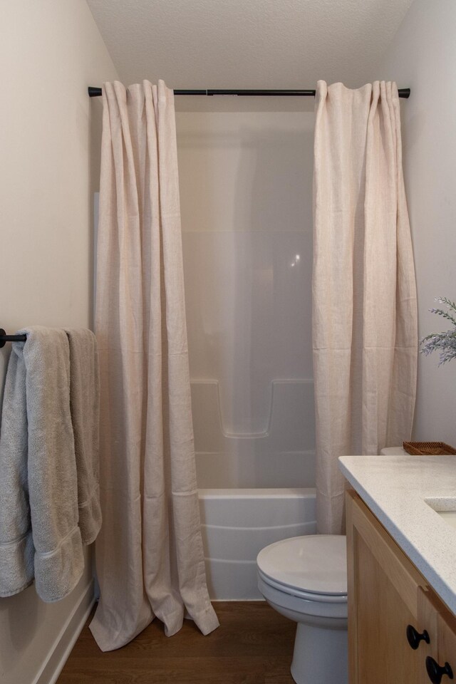31709 Green Scene Dr, Breezy Point, MN 56472 - full bath with wood finished floors, shower / bath combination with curtain, toilet, and vanity