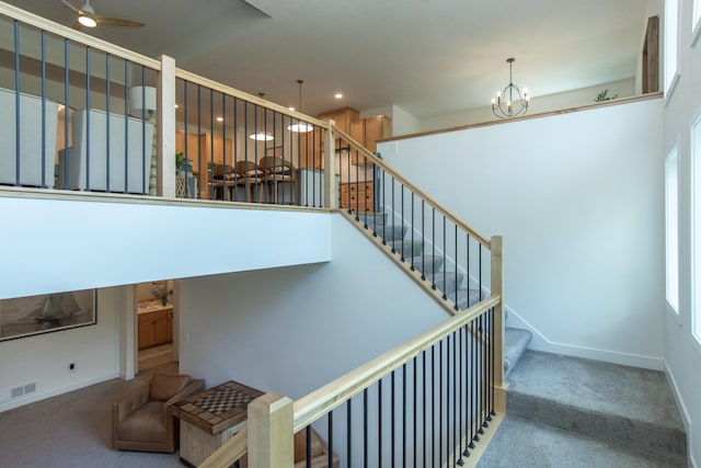31709 Green Scene Dr, Breezy Point, MN 56472 - stairs featuring carpet flooring, a chandelier, baseboards, recessed lighting, and a ceiling fan