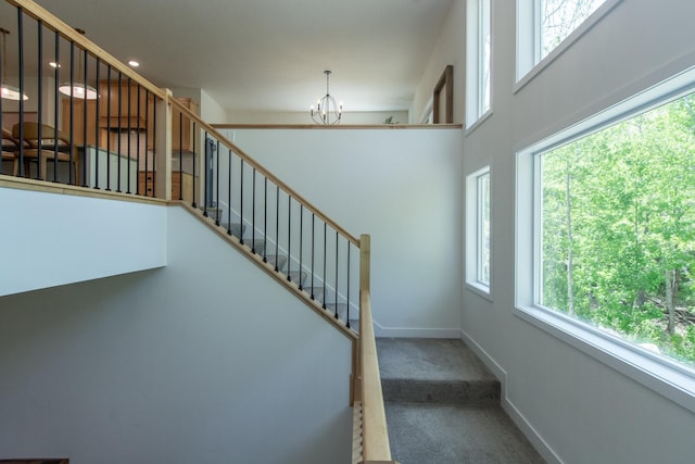 31709 Green Scene Dr, Breezy Point, MN 56472 - stairway with a chandelier, carpet, and baseboards