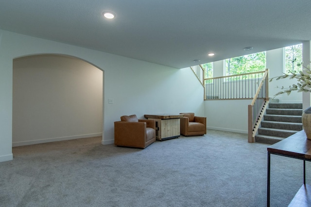 31709 Green Scene Dr, Breezy Point, MN 56472 - carpeted living area with arched walkways, healthy amount of natural light, recessed lighting, baseboards, and stairs