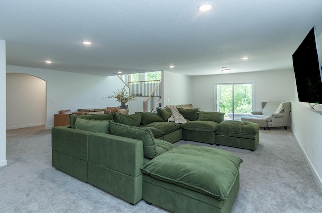 31709 Green Scene Dr, Breezy Point, MN 56472 - living area featuring light colored carpet, recessed lighting, arched walkways, healthy amount of natural light, and baseboards