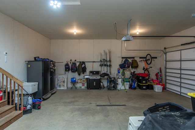 31709 Green Scene Dr, Breezy Point, MN 56472 - garage featuring a garage door opener