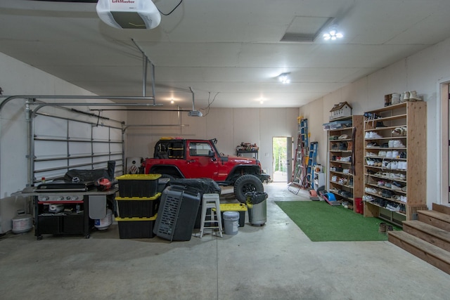 31709 Green Scene Dr, Breezy Point, MN 56472 - garage featuring a garage door opener