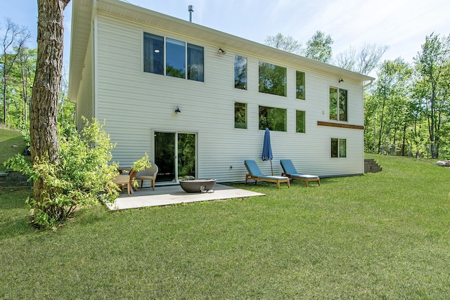31709 Green Scene Dr, Breezy Point, MN 56472 - back of house featuring a patio and a lawn