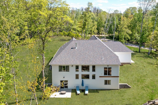 31709 Green Scene Dr, Breezy Point, MN 56472 - back of property with roof with shingles, a yard, a patio area, and a view of trees