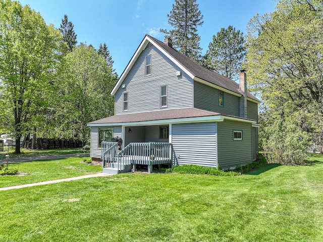 2444 County Rd 1, Wrenshall, MN 55797 - view of front of home featuring a chimney and a front lawn