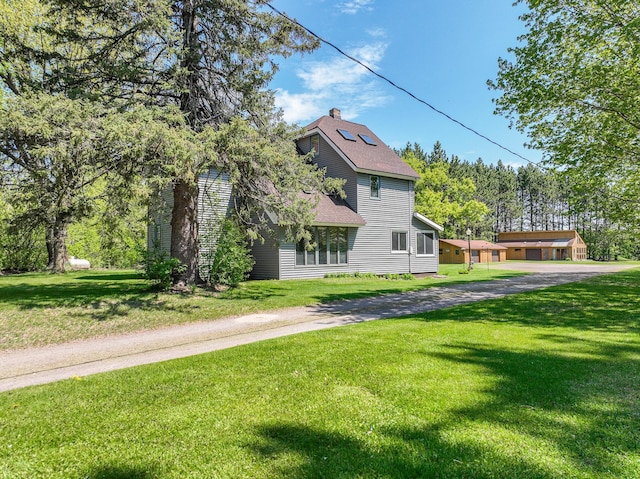 2444 County Rd 1, Wrenshall, MN 55797 - view of front of home with a front yard and a chimney