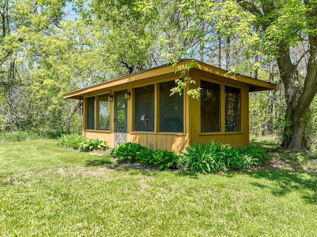 2444 County Rd 1, Wrenshall, MN 55797 - view of home's exterior with a lawn and a sunroom