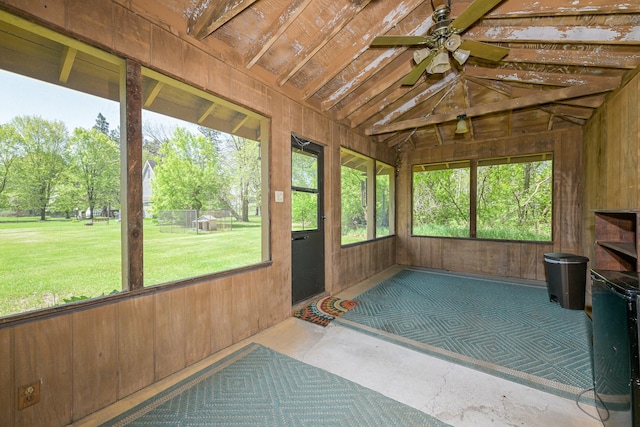 2444 County Rd 1, Wrenshall, MN 55797 - unfurnished sunroom with ceiling fan, wood walls, and vaulted ceiling