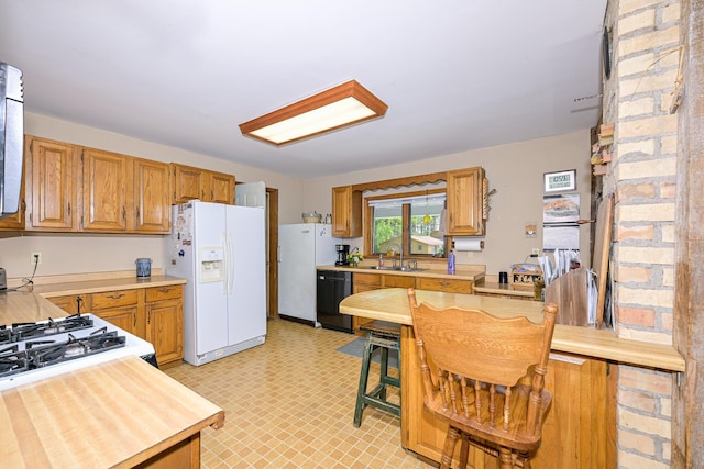 2444 County Rd 1, Wrenshall, MN 55797 - kitchen with white refrigerator with ice dispenser, dishwasher, light countertops, a sink, and freestanding refrigerator