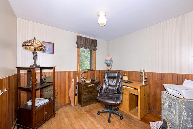 2444 County Rd 1, Wrenshall, MN 55797 - home office featuring wainscoting, light wood-type flooring, and wooden walls