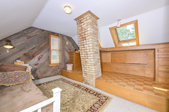 2444 County Rd 1, Wrenshall, MN 55797 - additional living space with decorative columns, wood walls, and lofted ceiling
