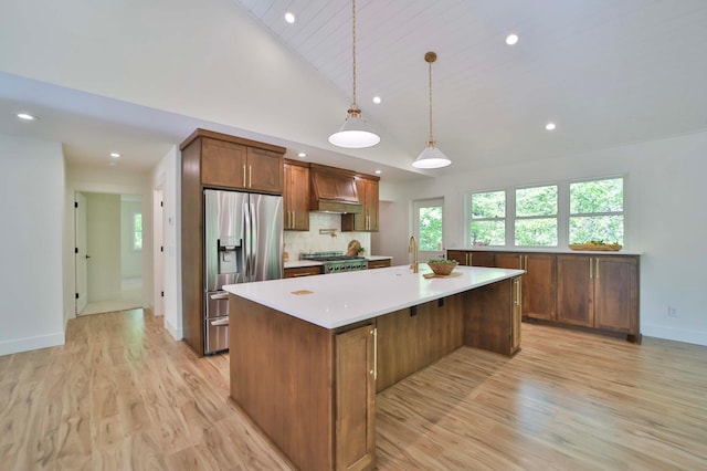 20482 Lord Rd, Center Twp, MN 56465 - kitchen featuring stainless steel fridge, light countertops, light wood finished floors, recessed lighting, and premium range hood
