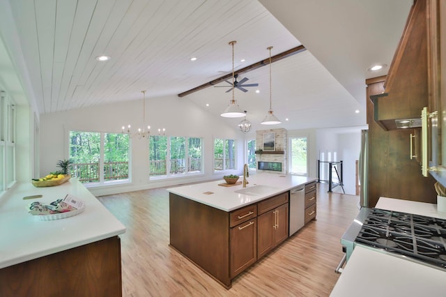 20482 Lord Rd, Center Twp, MN 56465 - kitchen featuring appliances with stainless steel finishes, light countertops, light wood-style flooring, an island with sink, and ceiling fan