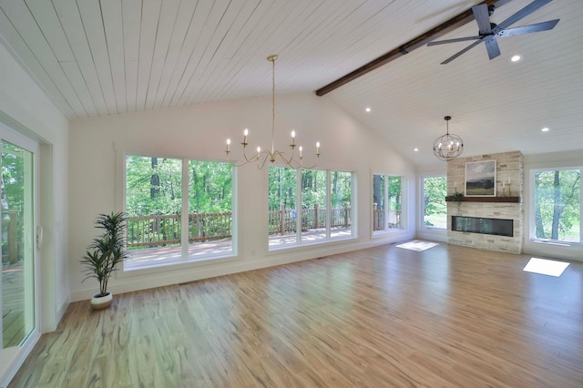 20482 Lord Rd, Center Twp, MN 56465 - unfurnished living room with a chandelier, light wood-type flooring, beamed ceiling, a fireplace, and a ceiling fan