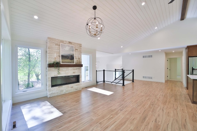 20482 Lord Rd, Center Twp, MN 56465 - unfurnished living room featuring lofted ceiling, light wood finished floors, wood ceiling, a chandelier, and recessed lighting
