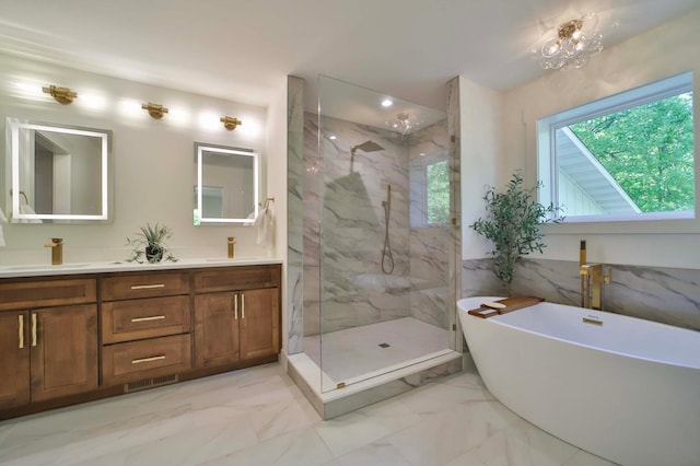 20482 Lord Rd, Center Twp, MN 56465 - bathroom with marble look tile flooring, a marble finish shower, a freestanding bath, double vanity, and recessed lighting