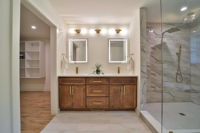 20482 Lord Rd, Center Twp, MN 56465 - bathroom with double vanity, marble look tiles, a marble finish shower, and recessed lighting