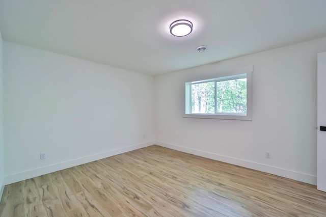 20482 Lord Rd, Center Twp, MN 56465 - empty room with light wood-type flooring and a smoke detector