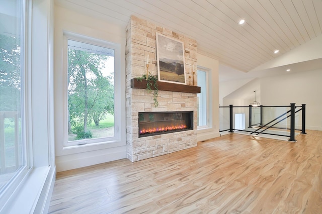 20482 Lord Rd, Center Twp, MN 56465 - unfurnished living room featuring vaulted ceiling, a stone fireplace, wood finished floors, wood ceiling, and recessed lighting
