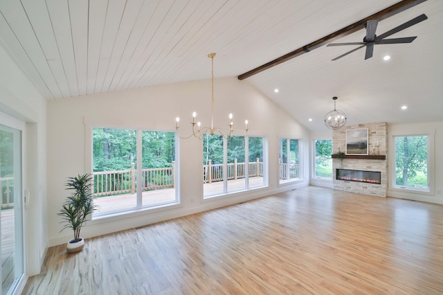 20482 Lord Rd, Center Twp, MN 56465 - unfurnished living room featuring a chandelier, beamed ceiling, light wood-type flooring, a stone fireplace, and ceiling fan