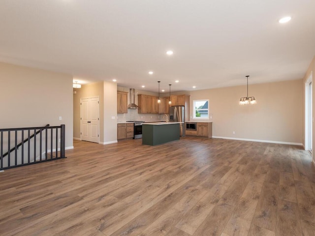5393 177th St W, Lakeville, MN 55044 - unfurnished living room with a chandelier, recessed lighting, wood finished floors, and baseboards